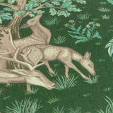 Close-up of The Brook jacquard polyester cushion in forest green, showing woven deer, oak leaves, and foliage detail in a woodland tapestry design.