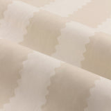 Close-up of Birdie Stripe pencil pleat curtain fabric in natural, showing a wavy contrast stripe pattern on lightweight cotton with soft folds.