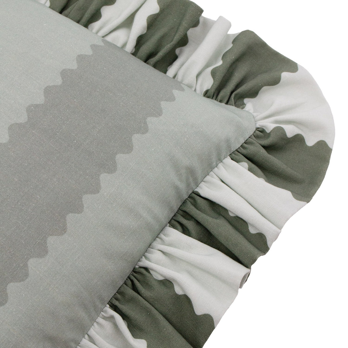 Close-up of the Birdie Stripe Frill Trim Cotton Cushion in Bay Green/Mist, showing the gathered ruffle edge in green and off-white against the muted sage-striped cotton face.