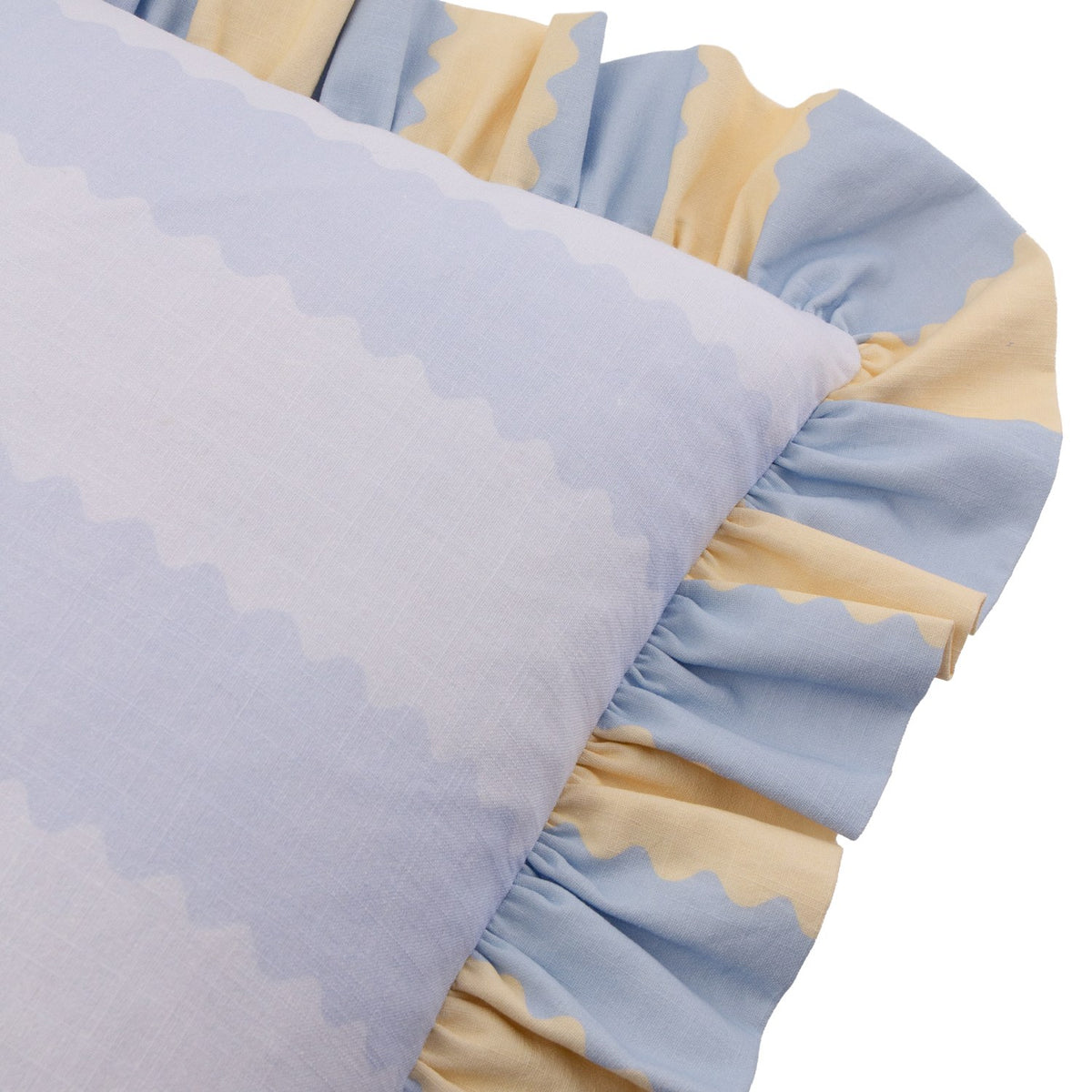 Close-up of the Birdie Stripe Frill Trim Cotton Cushion in Lemon/Sky, showing a sky blue cotton slub face with pale scalloped stripes and a gathered blue and yellow ruffle trim.