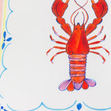 Brunch Stripes reversible polyester cushion, 45 x 45cm, showing a hand-painted red lobster within a scalloped border and blue coastal-stripe edging on white fabric.