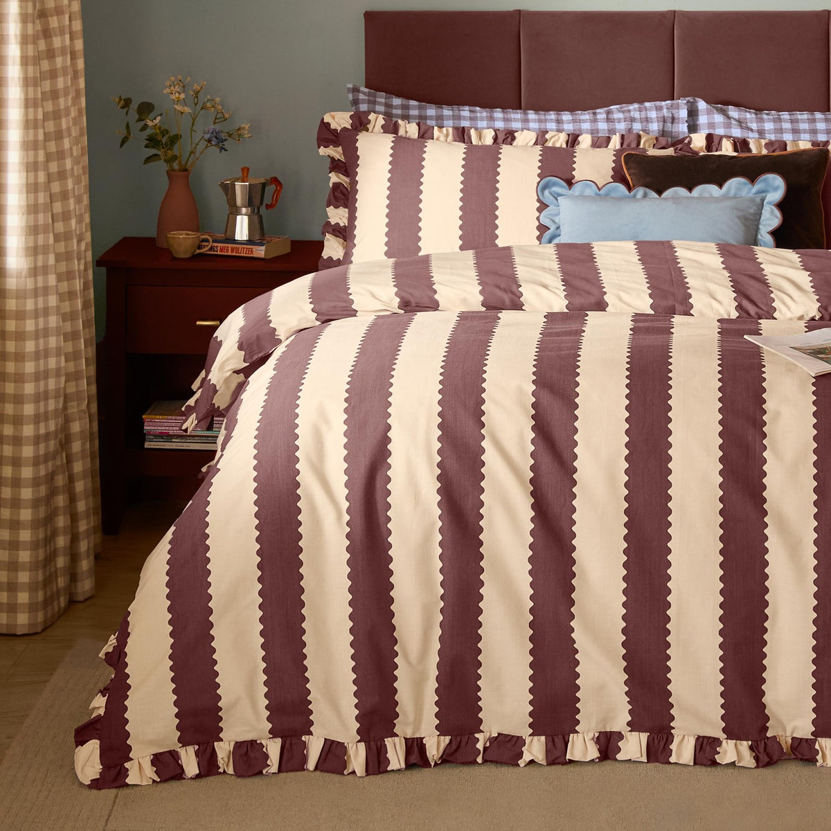 Birdie Stripe Frill Trim Duvet Cover Set in buttermilk and chocolate, showing scalloped vertical stripes and ruffled edges on a bed with matching pillowcases in a bedroom setting.