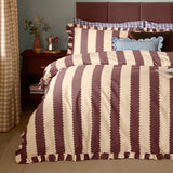 Birdie Stripe Frill Trim Duvet Cover Set in buttermilk and chocolate, showing scalloped vertical stripes and ruffled edges on a bed with matching pillowcases in a bedroom setting.