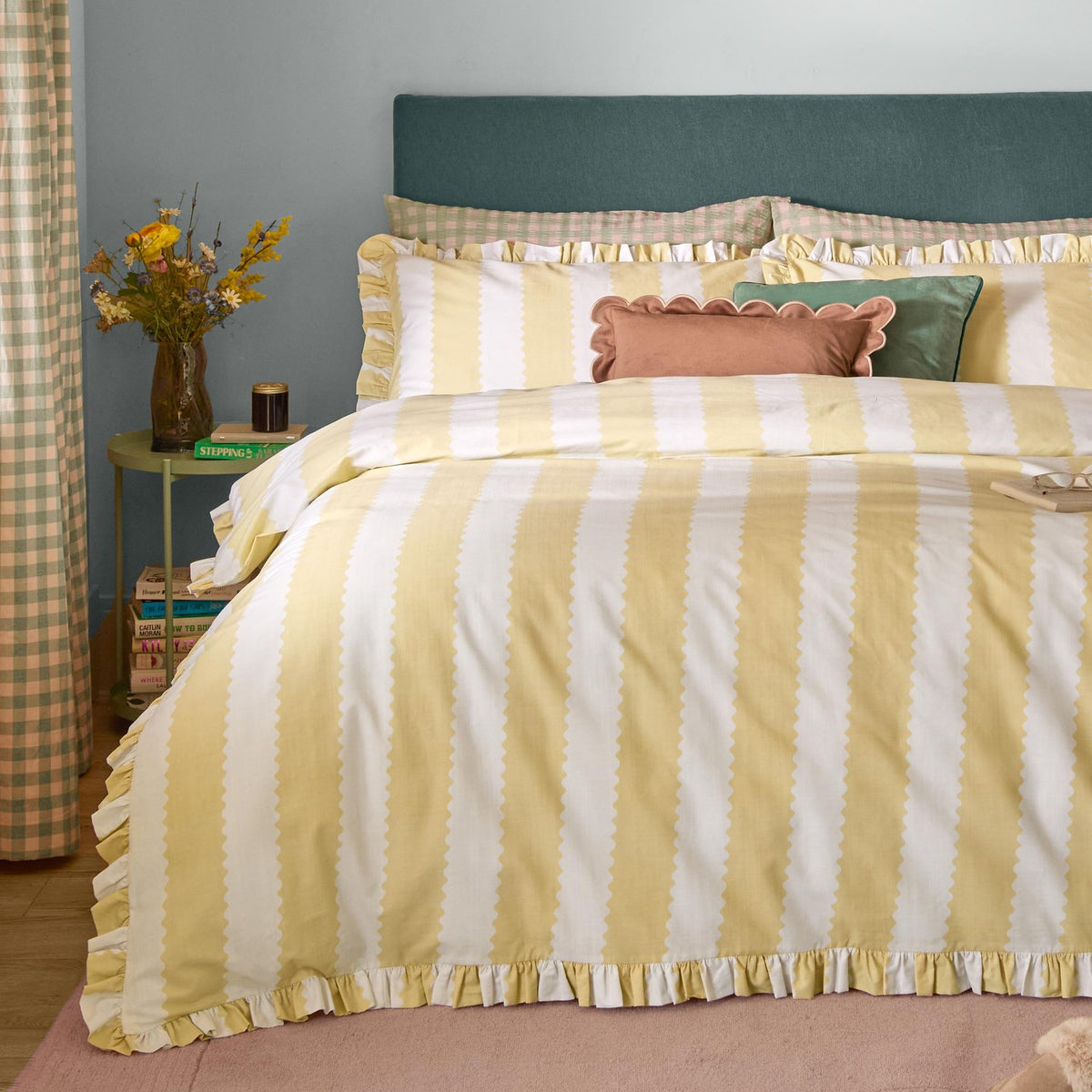 Birdie Stripe Cotton Frill Trim Duvet Cover Set in butter yellow, shown on a bed with matching pillowcases, ruffle trim edging, and gingham accents in a bedroom setting.
