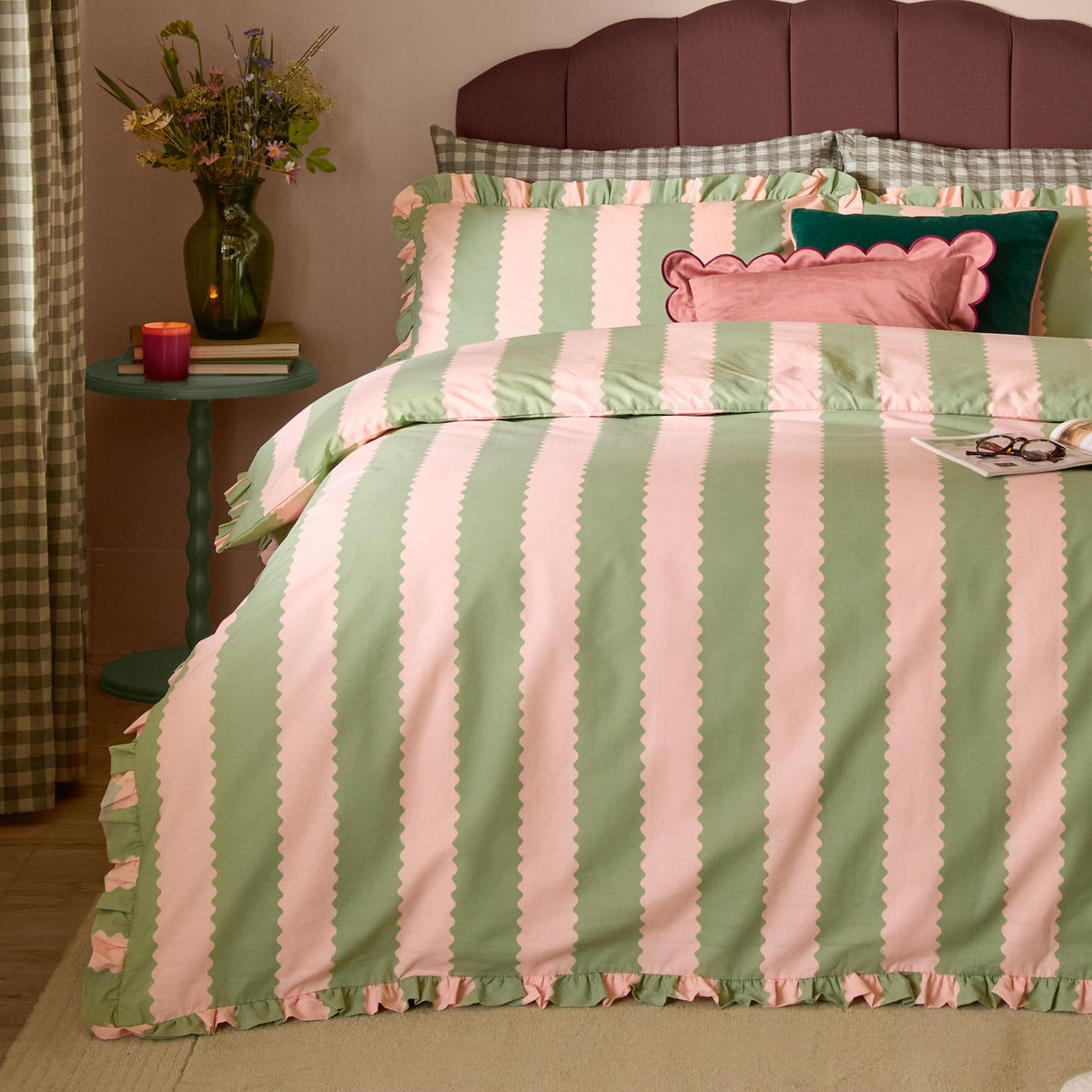 Birdie Stripe Cotton Frill Trim Duvet Cover Set in green and pink on a bed, with scalloped stripe pattern, gathered frill edging, and matching pillowcases in a bedroom setting.