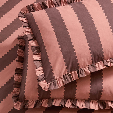 Birdie Stripe Cotton Blend Pillowcase Pair in Rose/Chocolate, featuring bold vertical stripes with scalloped edges and a gathered ruffle trim around each pillowcase.