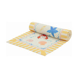 Brunch Stripes printed polyester table runner, partly rolled, showing a cream ground with yellow stripes, scalloped border, lobsters, starfish and shells, on a white background.