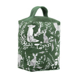 Buckthorn Animal Velvet Door Stop in evergreen, a fabric doorstop with carry handle printed with grey and white fox, rabbits, owl and bear among leaves and toadstools, shown on a white background.