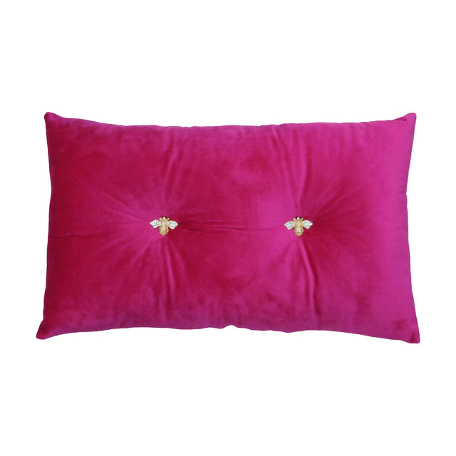 Bumble Hollowfibre Velvet Cushion in Fuchsia, an oblong bolster-shaped scatter cushion with a ruched centre and two jewelled gold bee buttons, shown on a plain white background.