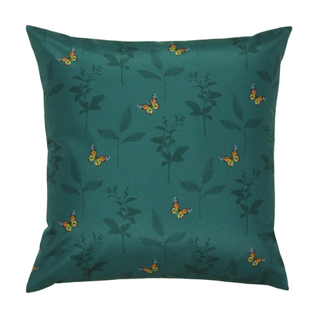 Square polyester cushion in teal green with a scattered pattern of monarch butterflies and dark leaf silhouettes, shown on a plain white background.