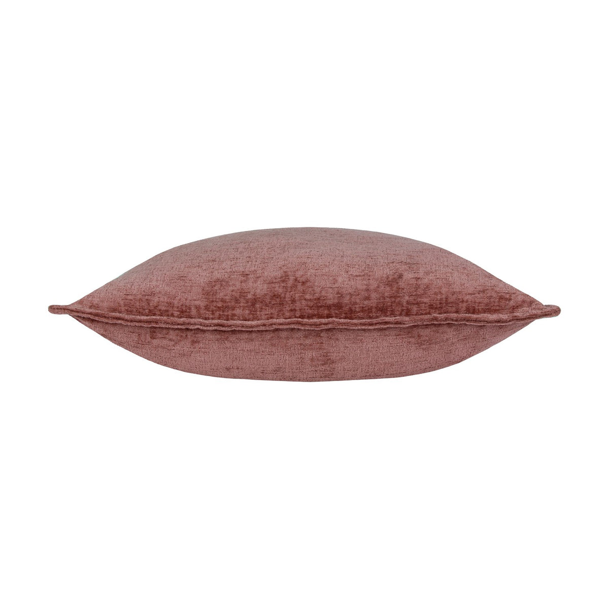 Side view of the Buxton reversible cushion in heather, showing a chenille-style woven polyester texture in dusky rose-pink, piped edge, and plump square shape on a white background.