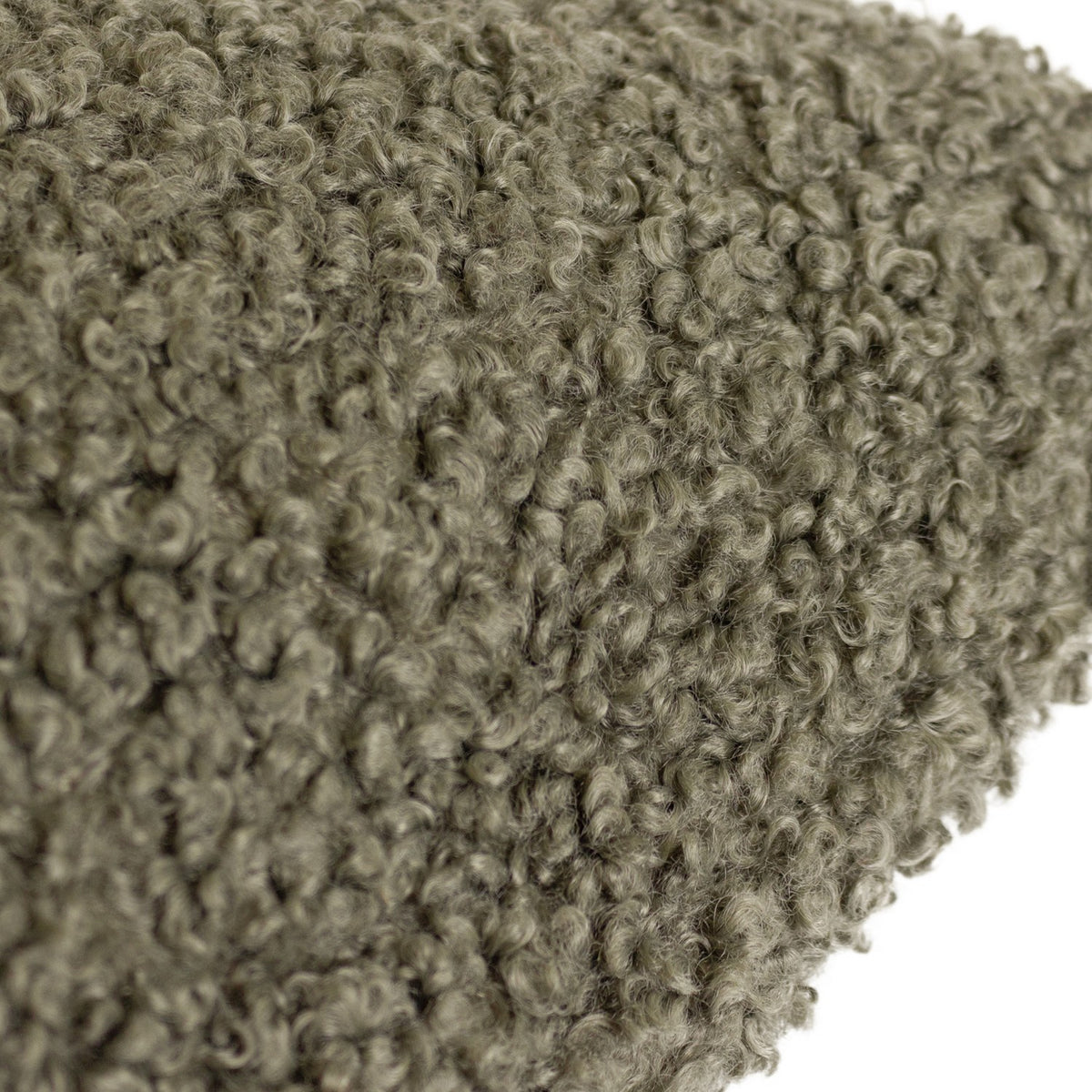 Close-up of the Cabu Reversible Wool Cushion in khaki, showing its all-over curled bouclé texture in a muted green polyester fabric.