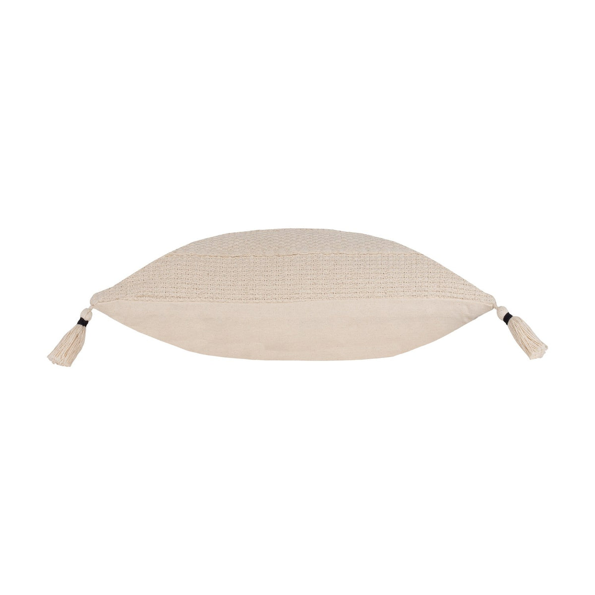 Side view of the Caliche Plain Cotton Cushion in natural cream, showing its plump textured cotton edge with corner tassels, on a plain white background.