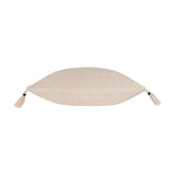 Side view of the Caliche Plain Cotton Cushion in natural cream, showing its plump textured cotton edge with corner tassels, on a plain white background.