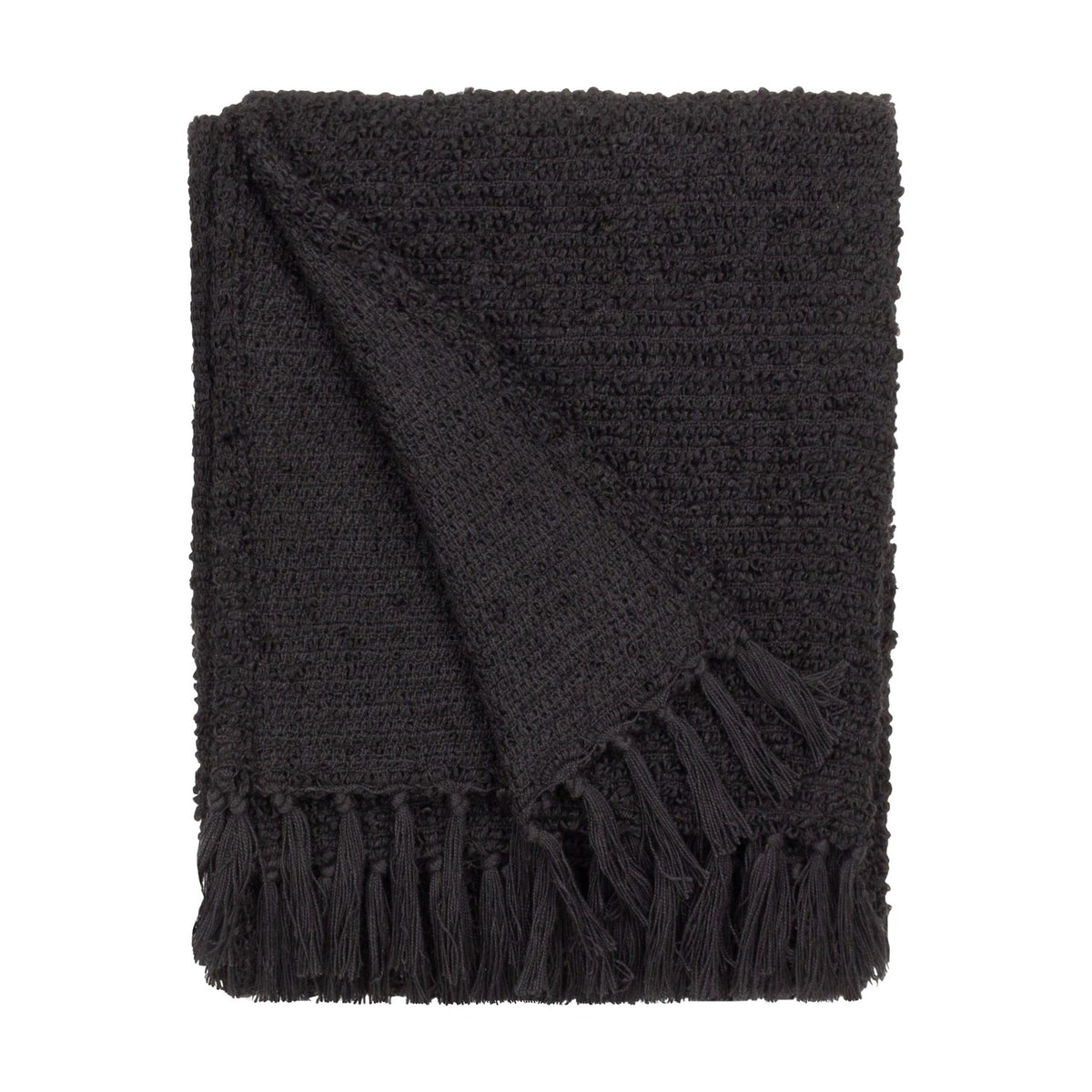 Candar Plain Polycotton Throw in black, folded to show a boucle-textured weave and hand-knotted fringe edge, set against a plain white background.