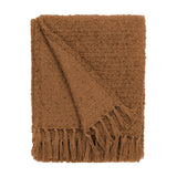 Candar Plain Polycotton Throw in ginger, folded to show its boucle-textured surface and hand-tied fringe edge, on a plain white background.