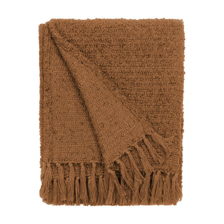 Candar Plain Polycotton Throw in ginger, folded to show its boucle-textured surface and hand-tied fringe edge, on a plain white background.