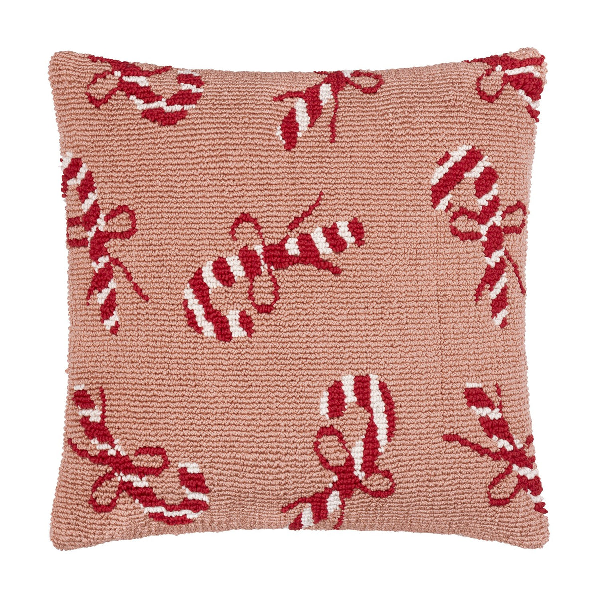 Square tufted cotton cushion in pink with a scattered red and white candy cane and bow pattern, shown on a plain white background.