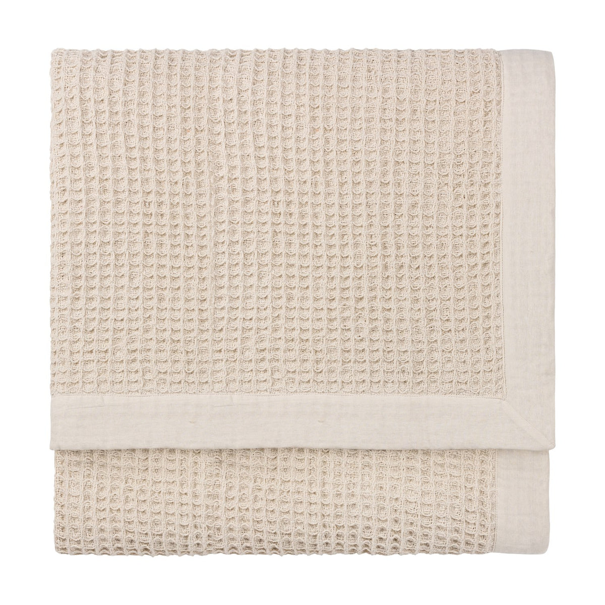 Canopy Plain Cotton Throw in natural, folded to show a chunky waffle weave with a wide plain cotton border, on a plain white background.