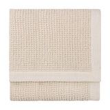Canopy Plain Cotton Throw in natural, folded to show a chunky waffle weave with a wide plain cotton border, on a plain white background.