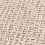 Close-up of the Canopy Plain Cotton Throw in natural beige, showing a chunky waffle weave texture in pure cotton.