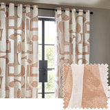 Carro Abstract Lined Eyelet Curtains in Clay, cream cotton fabric with clay-toned geometric shapes, hung on a black eyelet pole beside a dark-framed window.