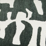 Close-up of the Caval Velvet Chenille Cushion in Ivy Green, showing an abstract jacquard pattern with dark green shapes on an off-white ground, contrasting boucle and chenille textures.