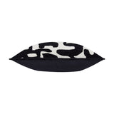 Caval Velvet Chenille Cushion in Mono, shown side-on to reveal its plump, boxed shape with black and off-white abstract jacquard front and plain black reverse, on a white background.