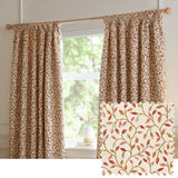 Cervino pencil pleat curtains in cream jacquard fabric with woven leaf and stem design in rust, terracotta, pink and green, shown hanging by a window with a matching fabric swatch.