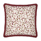 Cervino Jacquard Cotton Blend Cushion in Damson, square with dusky red fringe trim, cream ground featuring trailing leaf pattern in wine, pink, green and tan tones, shown on a white background.
