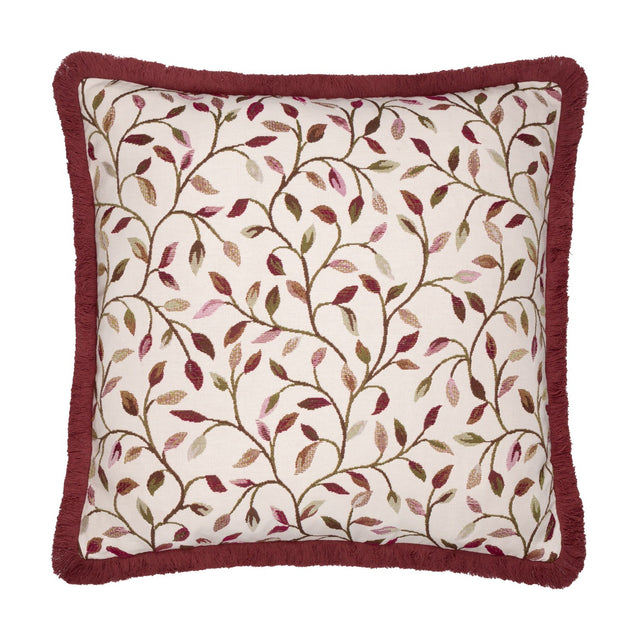 Cervino Jacquard Cotton Blend Cushion in Damson, square with dusky red fringe trim, cream ground featuring trailing leaf pattern in wine, pink, green and tan tones, shown on a white background.