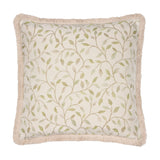 Square Cervino jacquard cotton blend cushion in cream with a woven green leaf and stem pattern, finished with a pale sandy fringe trim, on a plain white background.