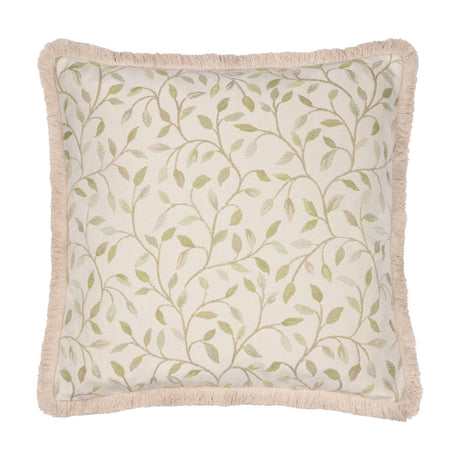 Square Cervino jacquard cotton blend cushion in cream with a woven green leaf and stem pattern, finished with a pale sandy fringe trim, on a plain white background.