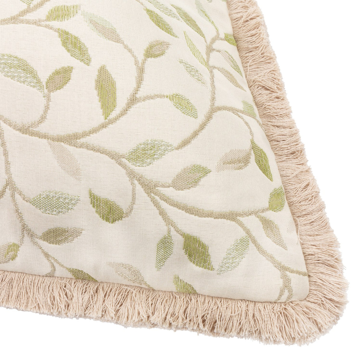 Cervino Jacquard Cotton Blend Cushion in Lichen, close-up corner view showing cream fabric with woven green leaf and vine pattern, edged with a sandy fringe trim.