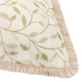 Cervino Jacquard Cotton Blend Cushion in Lichen, close-up corner view showing cream fabric with woven green leaf and vine pattern, edged with a sandy fringe trim.