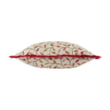 Cervino Jacquard Cotton Blend Cushion in Rednut, shown edge-on with cream fabric, red fringed trim, and a woven trailing leaf pattern in red, rust, and green tones on a white background.