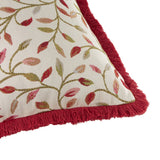 Cervino Jacquard Cotton Blend Cushion in Rednut, close-up of cream ground with jacquard woven leaf and vine pattern in red, rust and green, finished with a red fringe trim.