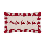 Rectangular lumbar cushion with hand-tufted "Fa la la la la" script on a cream face, framed by a red-and-white candy-stripe border, shown on a plain white background.