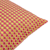 Close-up corner view of the Checkered Check Velvet Cushion in Hot Pink, showing a raised cut-velvet checkerboard pattern in pink and gold on a plain white background.