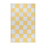 Checkerboard Jacquard Check Rug in yellow and off-white, large-scale square pattern, polypropylene outdoor rug shown on a plain white background.