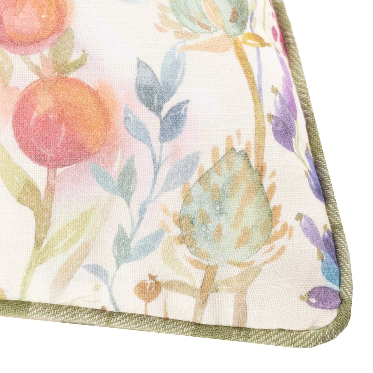 Close-up of the Country Hedgerow Reversible Linen Cushion corner, showing a watercolour floral print with fruit, foliage and berries edged in moss green piping.