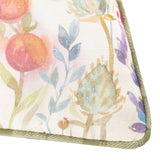Close-up of the Country Hedgerow Reversible Linen Cushion corner, showing a watercolour floral print with fruit, foliage and berries edged in moss green piping.