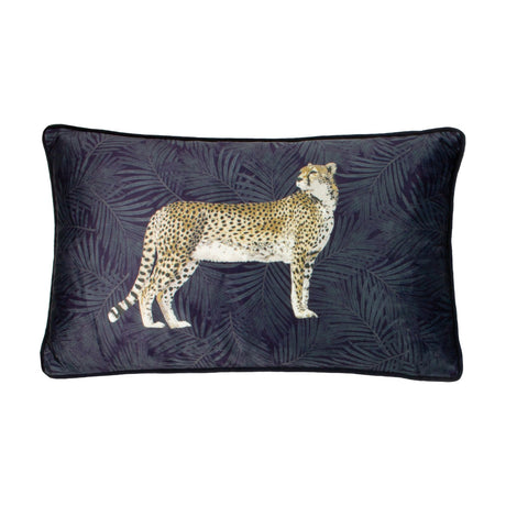 Rectangular navy velvet cushion featuring a printed side-on cheetah against a botanical palm frond background, with matching navy piping edging, shown on a white background.