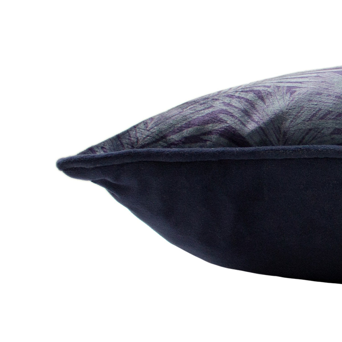 Close-up side view of the Cheetah Forest Animal Velvet Cushion in navy, showing plain navy velvet piping and reverse against a printed frond pattern, on a white background.