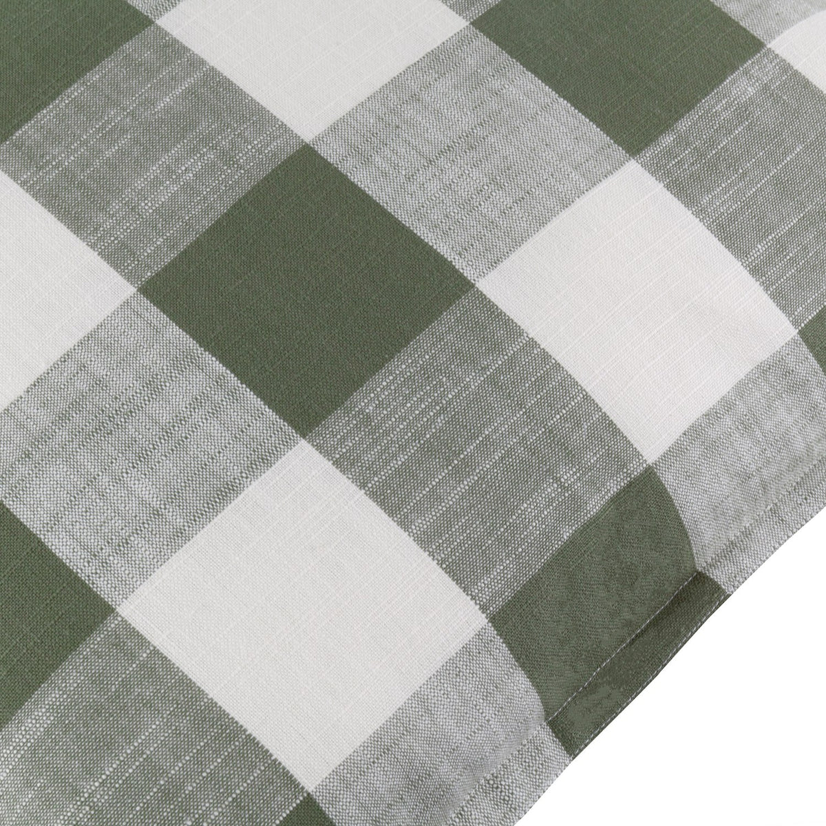 Close-up of the Chesil Check Printed Cotton Cushion in moss green, showing a large buffalo check pattern with off-white squares and a slubbed cotton texture.