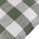 Close-up of the Chesil Check Printed Cotton Cushion in moss green, showing a large buffalo check pattern with off-white squares and a slubbed cotton texture.