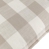 Close-up of the Chesil Check cotton cushion in natural, showing a beige and off-white check print with a woven texture and flat oxford border.