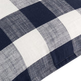 Close-up of the Chesil Check Printed Cotton Cushion in navy, showing a large buffalo check pattern in navy and cream cotton fabric with a stitched edge.