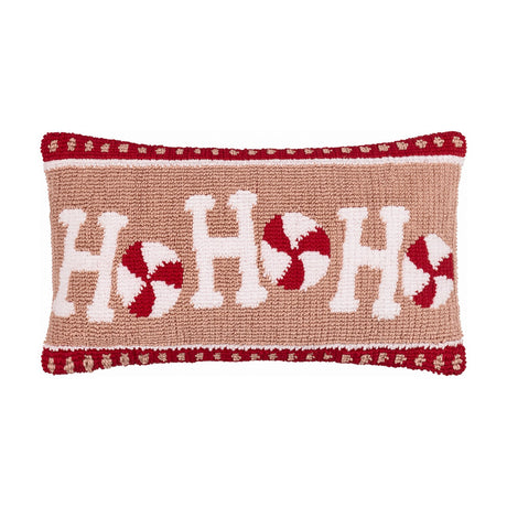 Candy Ho Ho Ho Plain Cotton Cushion in blush pink, featuring tufted white "Ho Ho Ho" lettering with red and white peppermint swirls, bordered by a red flecked band, on a plain white background.