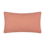 Rectangular cotton cushion in plain blush pink, shown reverse side with piped edge, on a white background.